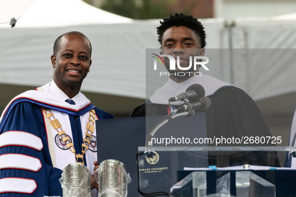 (L-R): Howard University President Dr. Wayne A.I. Frederick presents Actor and alumnus Chadwick Boseman with an honorary degree, Doctor of H...