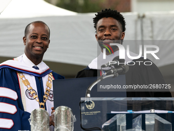 (L-R): Howard University President Dr. Wayne A.I. Frederick presents Actor and alumnus Chadwick Boseman with an honorary degree, Doctor of H...