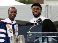 (L-R): Howard University President Dr. Wayne A.I. Frederick presents Actor and alumnus Chadwick Boseman with an honorary degree, Doctor of H...