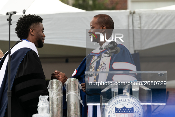 (L-R): Actor and alumnus Chadwick Boseman shakes hands with Howard University President Dr. Wayne A.I. Frederick, at the commencement ceremo...