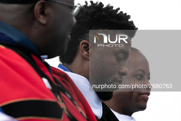 Actor and alumnus Chadwick Boseman (2nd right), after he delivered the keynote address at Howard University's commencement ceremony for the...