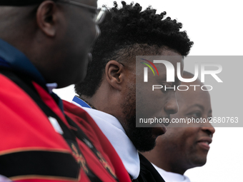 Actor and alumnus Chadwick Boseman (2nd right), after he delivered the keynote address at Howard University's commencement ceremony for the...