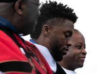 Actor and alumnus Chadwick Boseman (2nd right), after he delivered the keynote address at Howard University's commencement ceremony for the...