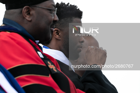 Actor and alumnus Chadwick Boseman (2nd right), after he delivered the keynote address at Howard University's commencement ceremony for the...