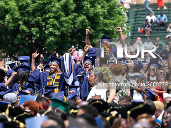 School of Communication graduates celebrate during the commencement ceremony for the 2018 graduating class with actor and alumnus Chadwick B...