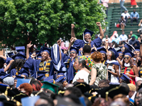 School of Communication graduates celebrate during the commencement ceremony for the 2018 graduating class with actor and alumnus Chadwick B...