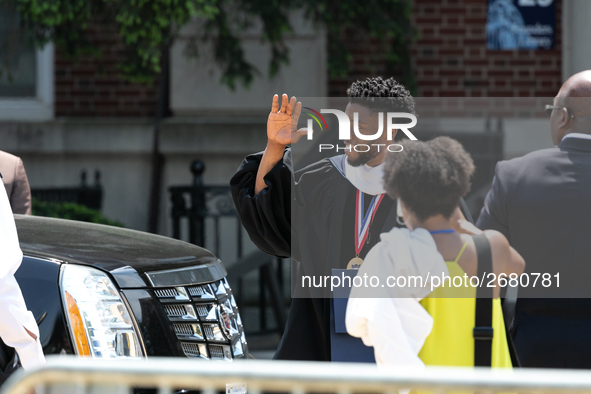 Actor and alumnus Chadwick Boseman (L), waves as he leaves Howard University's commencement ceremony for the 2018 graduating class. Boseman...