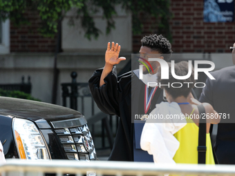 Actor and alumnus Chadwick Boseman (L), waves as he leaves Howard University's commencement ceremony for the 2018 graduating class. Boseman...