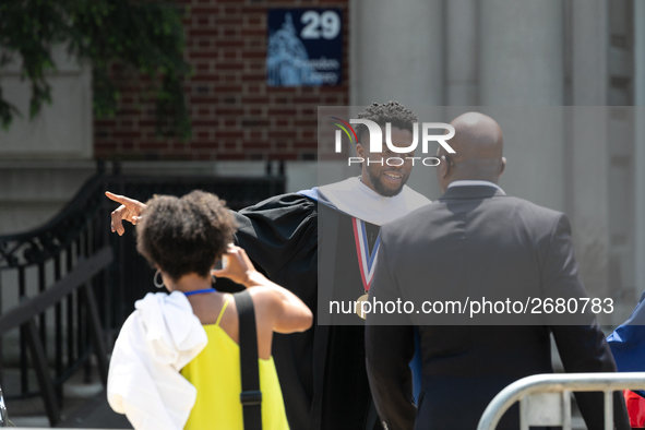 Actor and alumnus Chadwick Boseman (center), leaves after delivering the keynote address at Howard University's commencement ceremony for th...