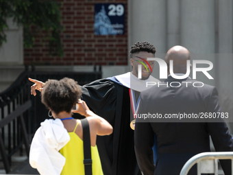 Actor and alumnus Chadwick Boseman (center), leaves after delivering the keynote address at Howard University's commencement ceremony for th...