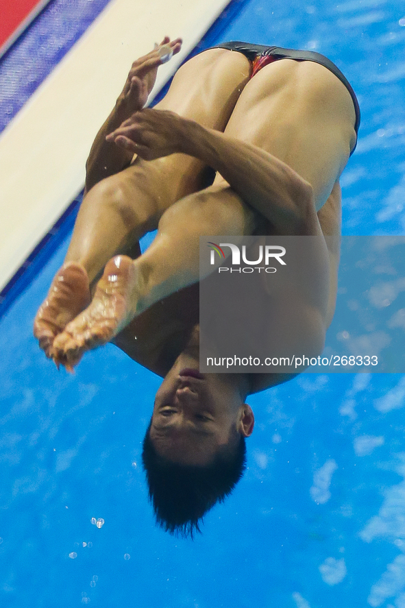 (141001) -- INCHEON, Oct. 1, 2014 () -- He Chao of China competes during the men's 1m springboard final of diving at the 17th Asian Games in...