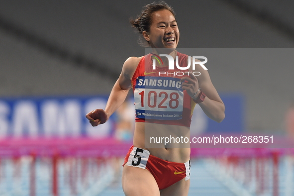 (141001) -- INCHEON, Oct. 1, 2014 () -- Wu Shuijiao of China sprints the finishing line during the women's 100m hurdles final of athletics a...