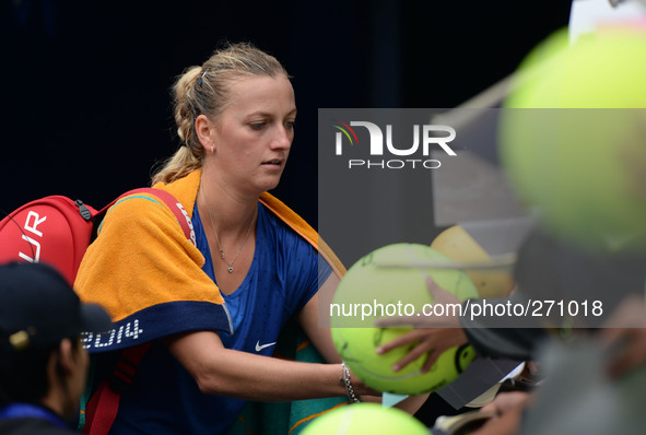 (141003) -- BEIJING, Oct. 3, 2014 () -- Petra Kvitova of Czech Republic signs autograph after winning the women's quarterfinal match against...