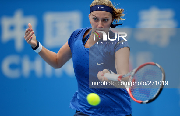 (141003) -- BEIJING, Oct. 3, 2014 () -- Petra Kvitova of Czech Republic returns a hit during the women's quarterfinal match against Roberta...