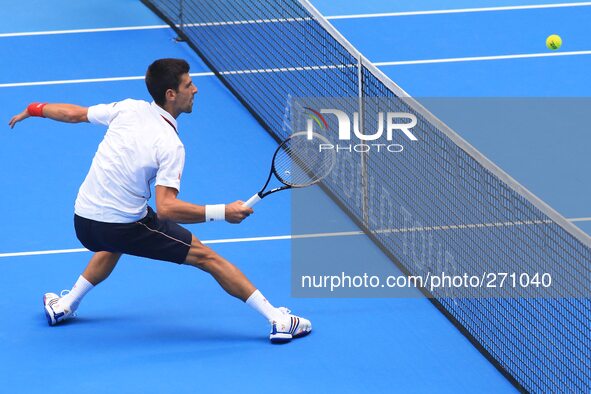 (141003) -- BEIJING, Oct. 3, 2014 () -- Novak Djokovic of Serbia returns a hit during the men's quarterfinal match against Grigor Dimitrov o...