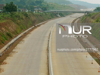 Jami Baitul Mustaghfirin Mosque, standing in the middle of the construction of Batang-Semarang Toll Road, Central Java. Indonesia in June, 4...