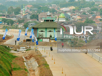 Jami Baitul Mustaghfirin Mosque, standing in the middle of the construction of Batang-Semarang Toll Road, Central Java. Indonesia in June, 4...