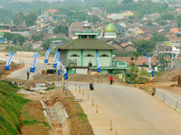 Jami Baitul Mustaghfirin Mosque, standing in the middle of the construction of Batang-Semarang Toll Road, Central Java. Indonesia in June, 4...