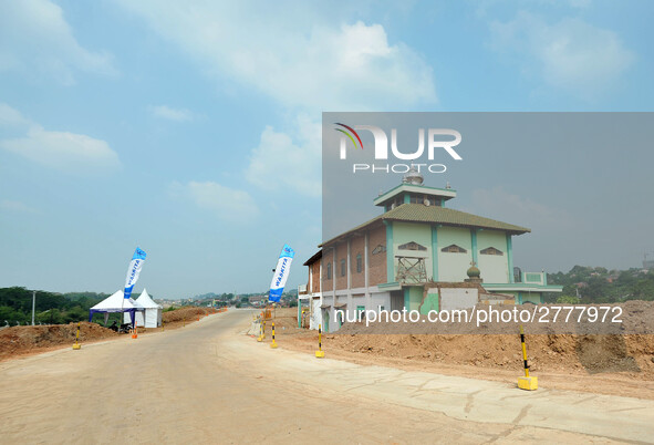 Jami Baitul Mustaghfirin Mosque, standing in the middle of the construction of Batang-Semarang Toll Road, Central Java. Indonesia in June, 4...