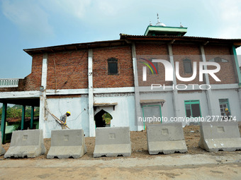 Jami Baitul Mustaghfirin Mosque, standing in the middle of the construction of Batang-Semarang Toll Road, Central Java. Indonesia in June, 4...