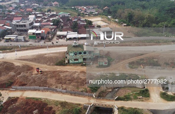 Jami Baitul Mustaghfirin Mosque, standing in the middle of the construction of Batang-Semarang Toll Road, Central Java. Indonesia in June, 4...