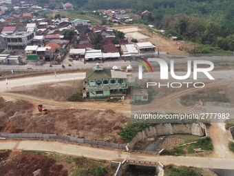 Jami Baitul Mustaghfirin Mosque, standing in the middle of the construction of Batang-Semarang Toll Road, Central Java. Indonesia in June, 4...