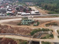 Jami Baitul Mustaghfirin Mosque, standing in the middle of the construction of Batang-Semarang Toll Road, Central Java. Indonesia in June, 4...