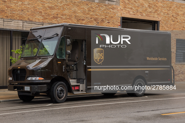 A United Parcel Service of America truck and drop-off box are seen along Milwaukee Avenue in the Old Irving Park neighborhood of Chicago, IL...