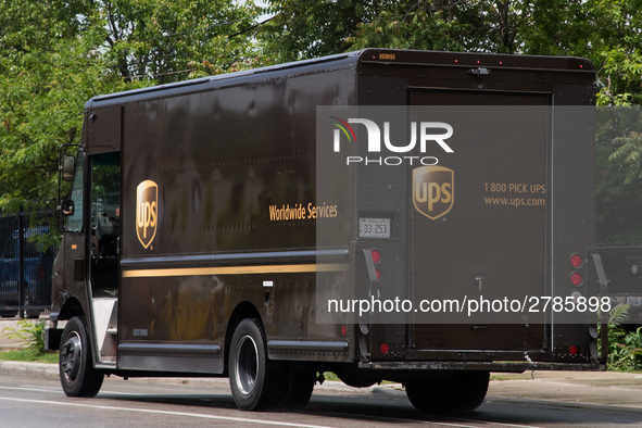 A United Parcel Service of America truck and drop-off box are seen along Milwaukee Avenue in the Old Irving Park neighborhood of Chicago, IL...