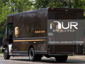 A United Parcel Service of America truck and drop-off box are seen along Milwaukee Avenue in the Old Irving Park neighborhood of Chicago, IL...