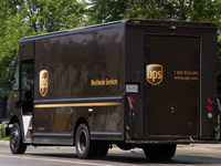 A United Parcel Service of America truck and drop-off box are seen along Milwaukee Avenue in the Old Irving Park neighborhood of Chicago, IL...