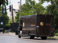 A United Parcel Service of America truck and drop-off box are seen along Milwaukee Avenue in the Old Irving Park neighborhood of Chicago, IL...