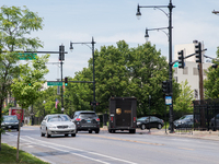 A United Parcel Service of America truck and drop-off box are seen along Milwaukee Avenue in the Old Irving Park neighborhood of Chicago, IL...