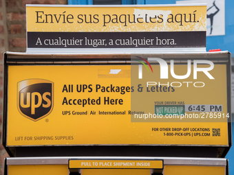 A United Parcel Service of America truck and drop-off box are seen along Milwaukee Avenue in the Old Irving Park neighborhood of Chicago, IL...