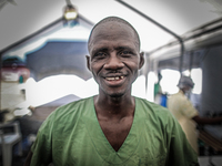 Lassana Gabana, a 35-year-old Ebola survivor turned social worker talks to patients and provides comfort. 
The World Health Organization say...