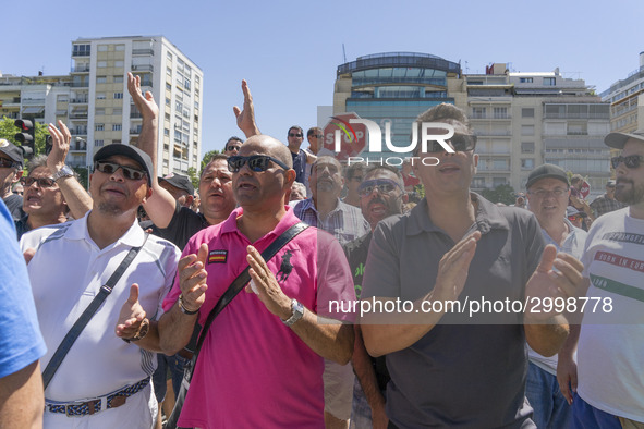 taxis block an avenue amid a strike by cabbies in Madrid on July 31, 2018. - Taxi drivers across Spain kept striking against ride-hailing co...