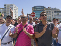 taxis block an avenue amid a strike by cabbies in Madrid on July 31, 2018. - Taxi drivers across Spain kept striking against ride-hailing co...