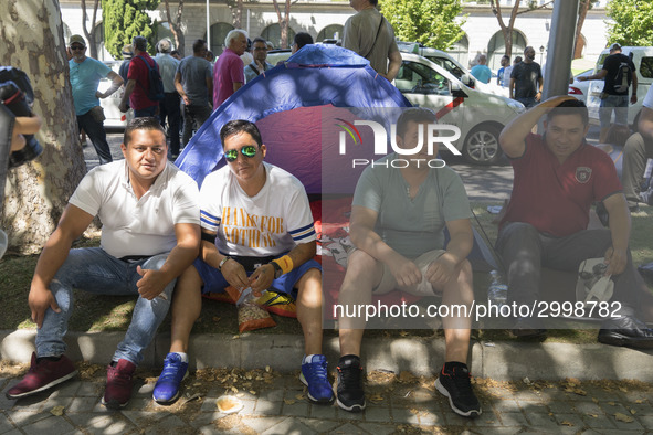 taxis block an avenue amid a strike by cabbies in Madrid on July 31, 2018. - Taxi drivers across Spain kept striking against ride-hailing co...