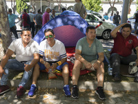 taxis block an avenue amid a strike by cabbies in Madrid on July 31, 2018. - Taxi drivers across Spain kept striking against ride-hailing co...