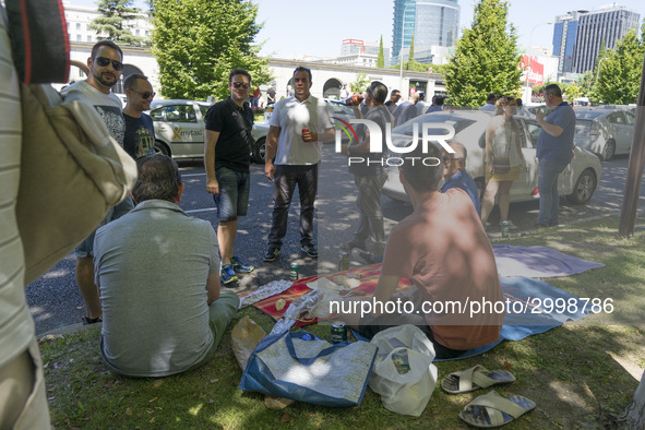 taxis block an avenue amid a strike by cabbies in Madrid on July 31, 2018. - Taxi drivers across Spain kept striking against ride-hailing co...