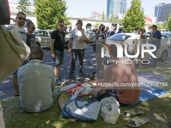 taxis block an avenue amid a strike by cabbies in Madrid on July 31, 2018. - Taxi drivers across Spain kept striking against ride-hailing co...