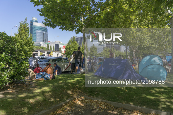 taxis block an avenue amid a strike by cabbies in Madrid on July 31, 2018. - Taxi drivers across Spain kept striking against ride-hailing co...