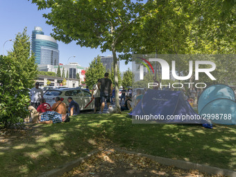 taxis block an avenue amid a strike by cabbies in Madrid on July 31, 2018. - Taxi drivers across Spain kept striking against ride-hailing co...