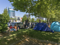 taxis block an avenue amid a strike by cabbies in Madrid on July 31, 2018. - Taxi drivers across Spain kept striking against ride-hailing co...