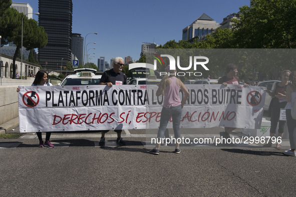 taxis block an avenue amid a strike by cabbies in Madrid on July 31, 2018. - Taxi drivers across Spain kept striking against ride-hailing co...