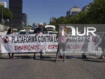 taxis block an avenue amid a strike by cabbies in Madrid on July 31, 2018. - Taxi drivers across Spain kept striking against ride-hailing co...