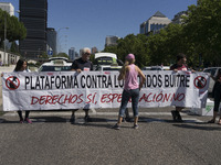 taxis block an avenue amid a strike by cabbies in Madrid on July 31, 2018. - Taxi drivers across Spain kept striking against ride-hailing co...