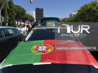 taxis block an avenue amid a strike by cabbies in Madrid on July 31, 2018. - Taxi drivers across Spain kept striking against ride-hailing co...