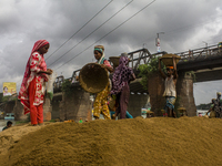 Women during the Day labors are working in a domestic port in Dhaka, Bangladesh, on 14 August 2018. (