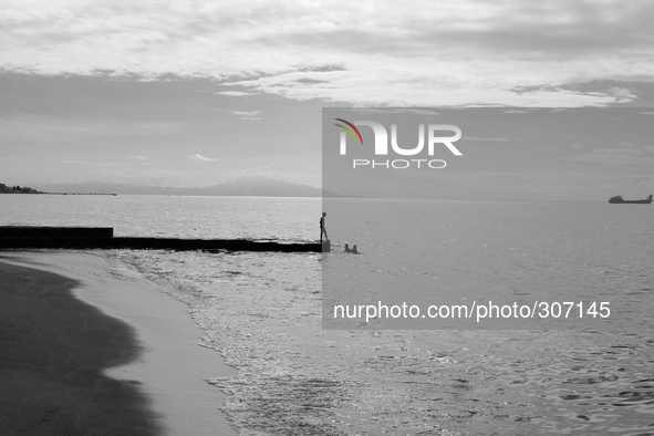 A lone fisherman on Dili beach 